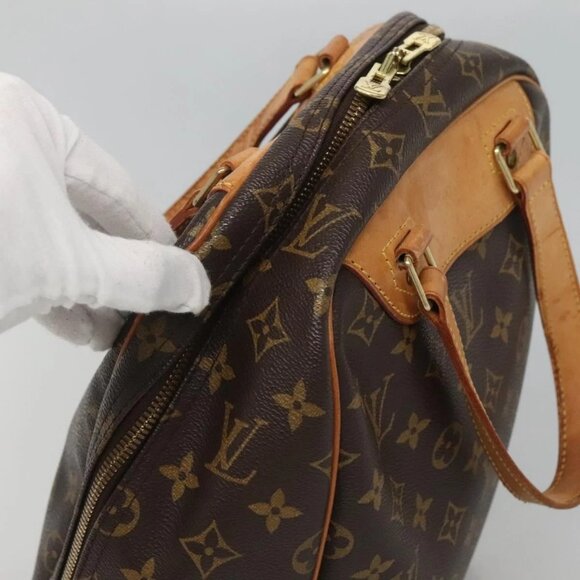 LOUIS VUITTON Monogram Excursion Hand Bag - Picture 14 of 16